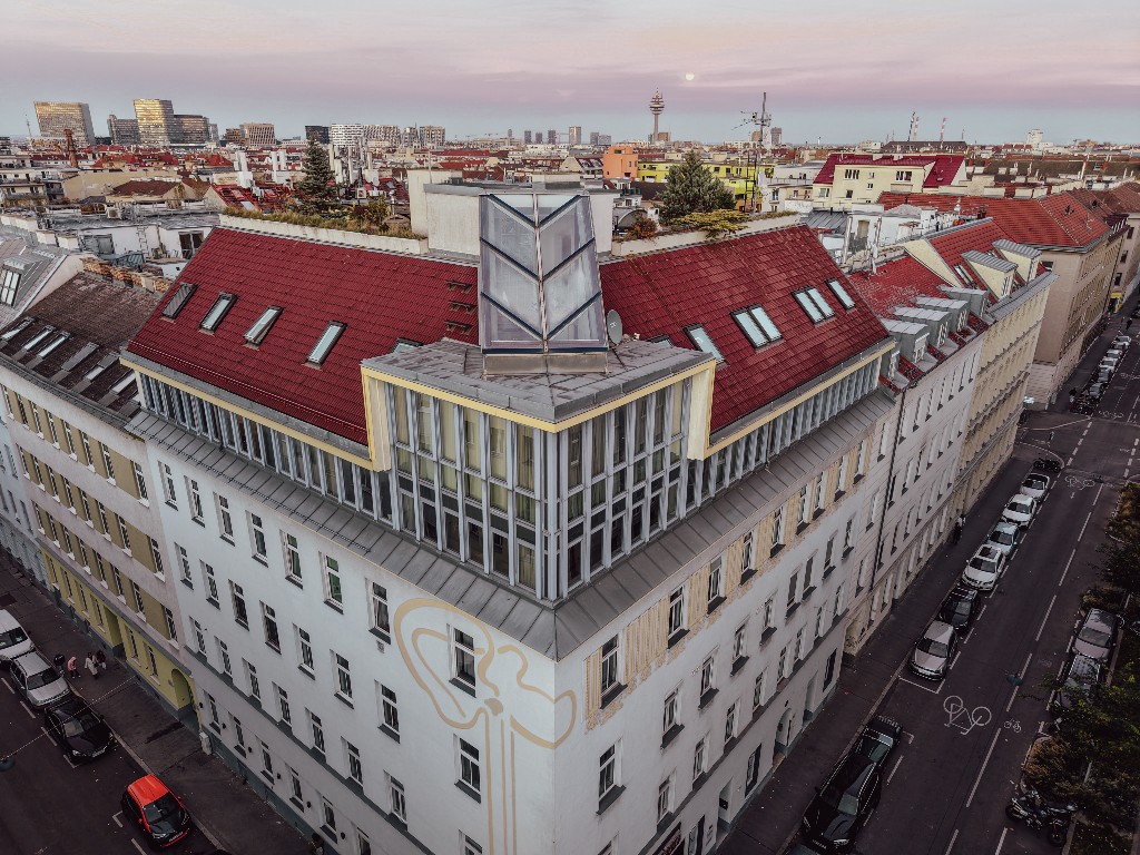 The Residency Vienna — corner building at dusk, Vienna skyline